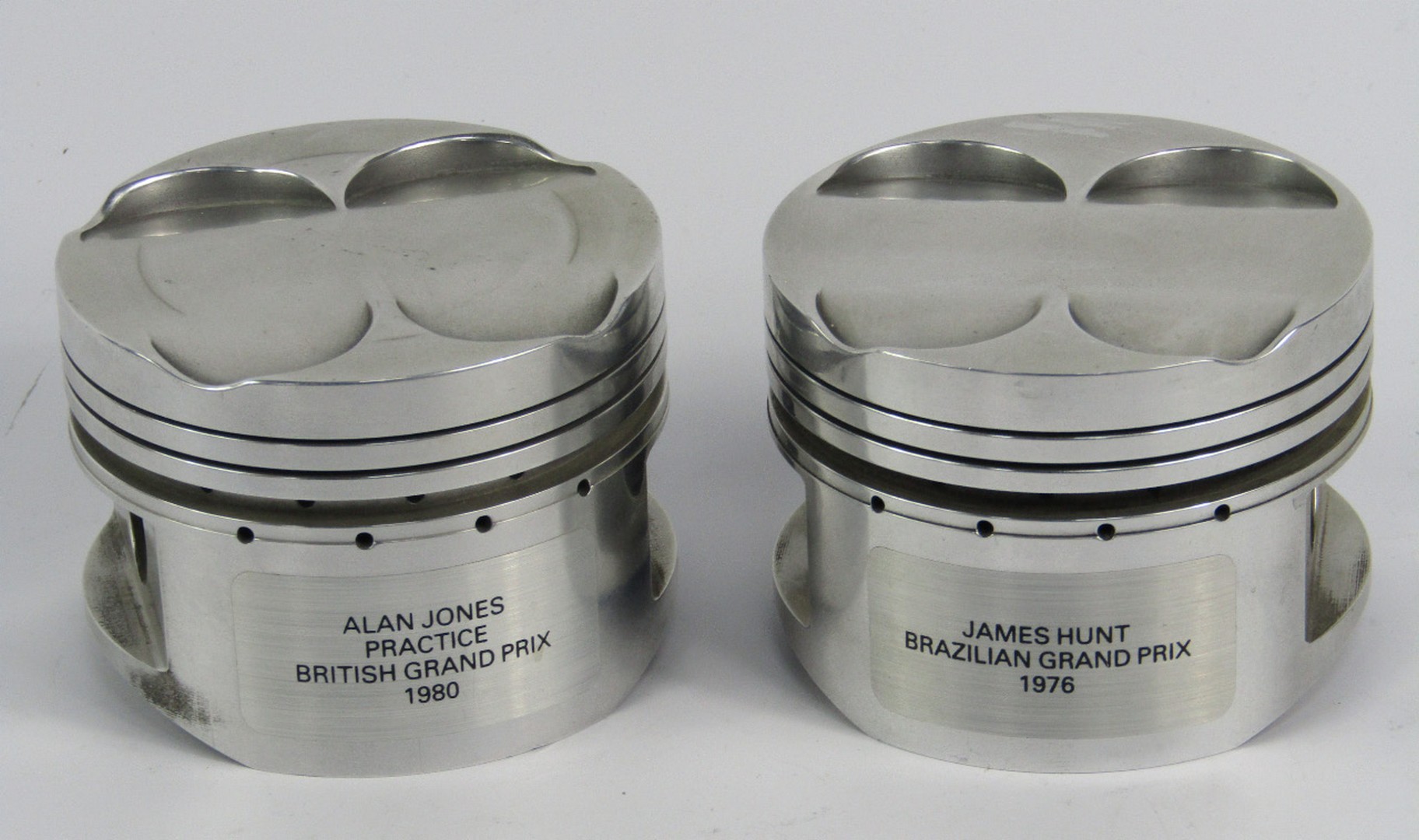 Two pistons from Formula One cars, namely James Hunt Brazilian Grand