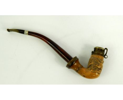 A Meerschaum pipe, carved with a wolf in a forest, late 19thC, 26cm long.