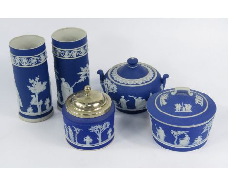 Wedgwood dark blue jasperware, late 19thC, sprigged with classical figures, comprising a pair of spill vases, sucrier, butter