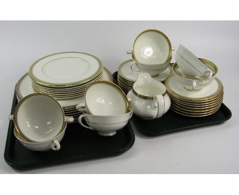A Royal Doulton porcelain part dinner service, decorated in the Clarenden pattern, comprising eight dinner and dessert plates