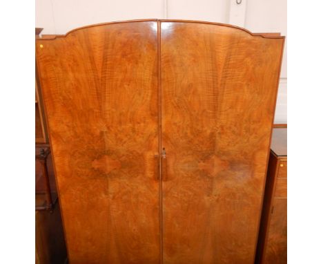 A 1920's figured walnut bedroom suite, comprising fitted wardrobe compactum, tallboy, dressing table with stool, pot cupboard