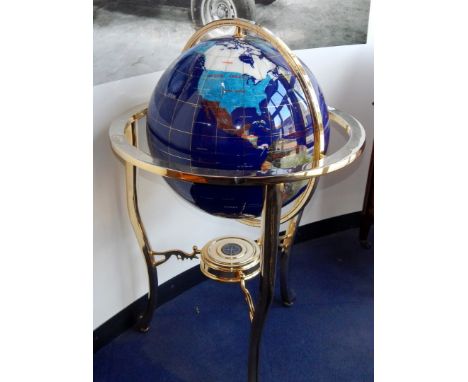 A hardstone set terrestial globe, in a brass gimbal stand, globe 50cm diameter