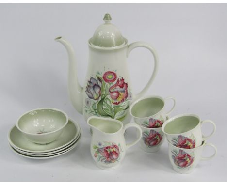 A Susie Cooper porcelain part coffee service, decorated with tulips, comprising coffee pot, cream jug, sugar bowl, six cups a