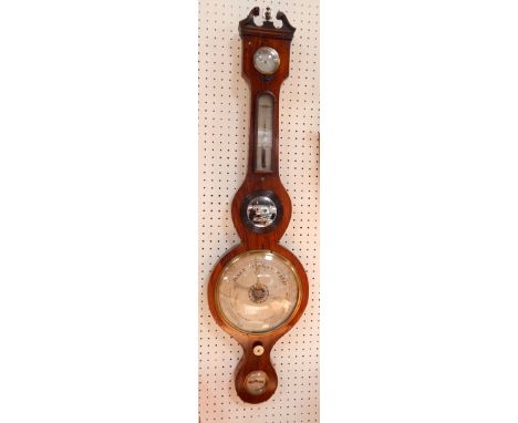 A George III rosewood wheel barometer, silvered dial, thermometer and damp/dry dial, 97cm long