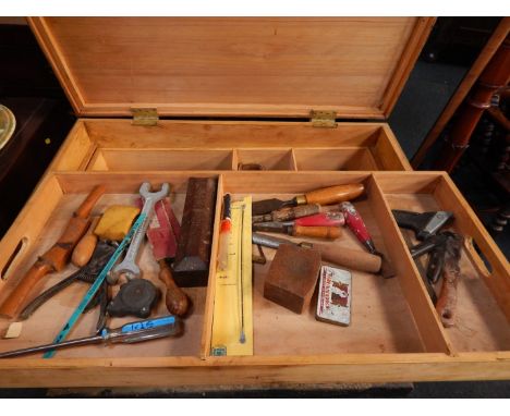 A black painted pine carpenter's tool chest, containing a quantity of vintage and later tools.