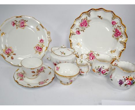 Royal Crown Derby porcelain, decorated in the Derby Posies pattern, comprising dinner plates, four cream jugs, sucrier, trink