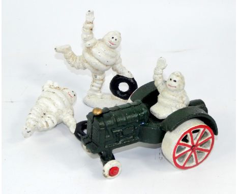 * Two enamel Michelin Man figures, and a Michelin Man on a tractor, (3)