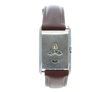 Vintage white metal rectangular digital gentleman's wristwatch, hour and minute and seconds apertures, unsigned movement, cas