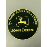 Cast Iron advertising sign John Deer approximately 24cm across