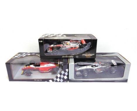 THREE 1/18 SCALE DIECAST MODEL FORMULA 1 RACING CARS comprising a Minichamps Team McLaren Mercedes, David Coulthard; Minicham