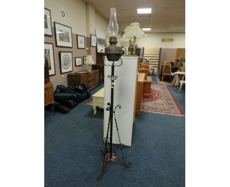 AN ANTIQUE WROUGHT LAMP STANDARD