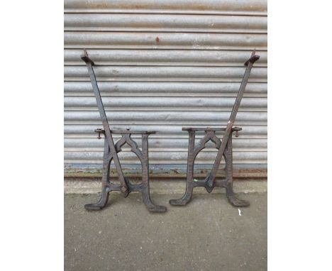 A PAIR OF FISHER &amp; SON OF WEST BROMWICH REVERSIBLE RAILWAY PLATFORM CAST METAL BENCH ENDS