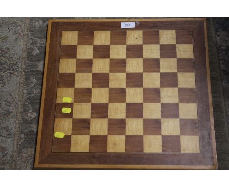 A VINTAGE WOODEN CHESS BOARD