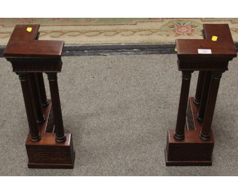 A PAIR OF BOOKENDS IN THE FORM OF UNUSUAL ARCHITECTURAL STRUCTURES