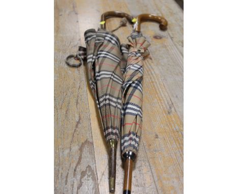A VINTAGE BURBERRY STYLE PARASOL SHAPED UMBRELLA TOGETHER WTIH A MODERN REPRODUCTION EXAMPLE (2)