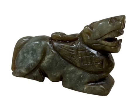 A carved jade figure of a tiger. (length 9cm)