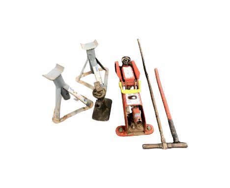 A box of tools including car jack 