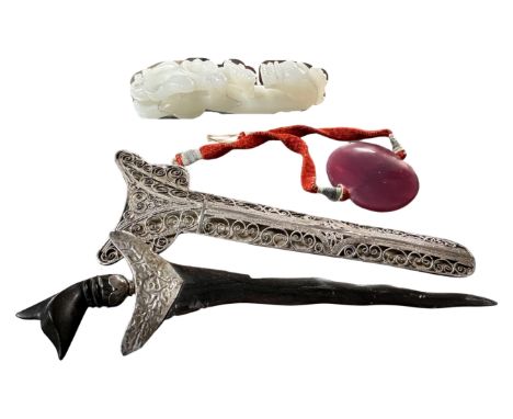 A South-East Asian Kris dagger with white metal mounts together with a carved jade ruyi sceptre and a further hardstone brace