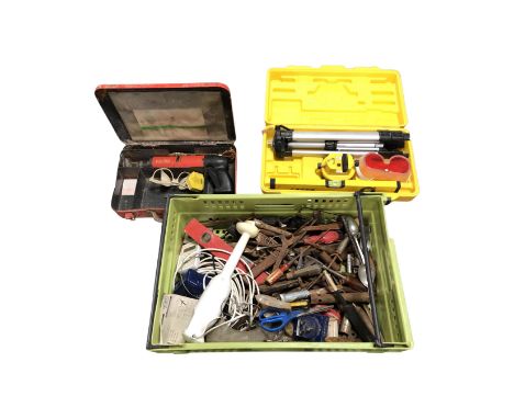 A plastic crate containing assorted hand tools and spirit level together with a boxed laser level and a Hilti DX400 powder ac