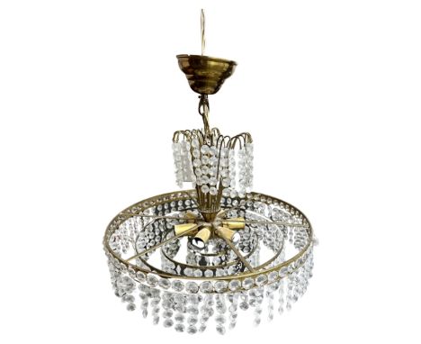 A Continental gilt brass chandelier with glass drops
