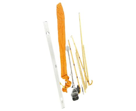 A spirit level, quantity of measuring sticks, walking stick, shooting stick and two piece fishing rod 