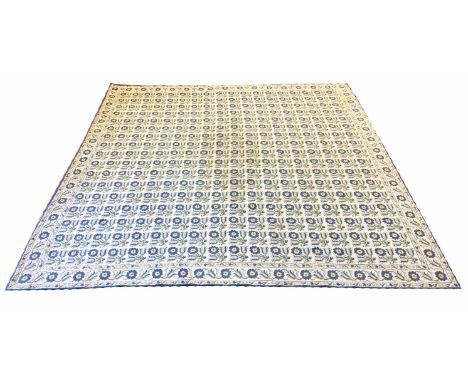 HELLENIC ISLANDS FLATWEAVE CARPET, 273cm x 267cm, repeat floral motifs, on an ivory field within corresponding border.