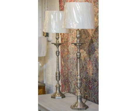 CANDLESTICK LAMPS, a pair, silver plated of candlestick form, with shades, 85cm H excluding shades. (2)