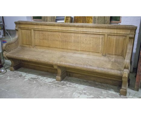 COUNTRY HOUSE HALL BENCH, 19th century Neoclassical carved oak with curved seat and scroll supports, 255cm W.
