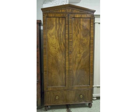 WARDROBE, early 19th century, William IV, flame mahogany, with architectural cornice, two panelled doors, enclosing double ha