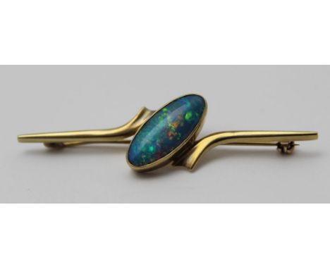 A black opal set 9ct bar brooch, the stone is 18mm x 8mm, gross weight: 4.2g 