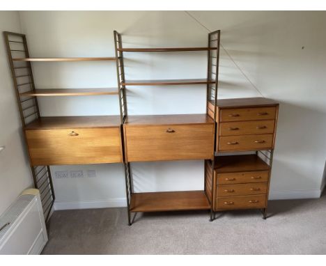 An extensive selection of Staples Ladderax branded modular storage solutions, having numerous plain shelves, storage cabinets
