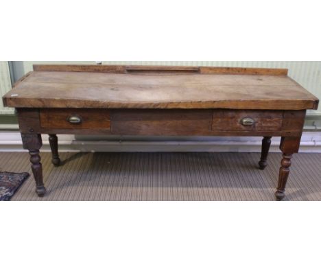 A large Manor house kitchen preparation table, having twin planked butchers block supported on an associated softwood base, c