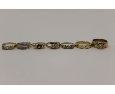 A collection of six 9ct gold dress rings, one set bands of tiny diamonds, together with a 14k ring (7) 