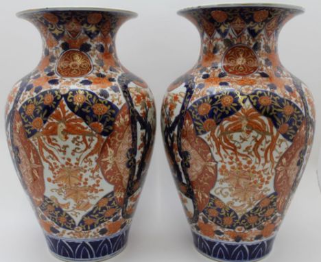 A pair of 20th century Japanese porcelain vases hand painted & gilded in the Imari palette, baluster form with flared rims, u