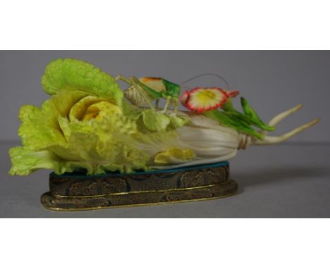 A fine vintage Chinese carved ivory figure depicting a grasshopper on a lettuce, 21cm long approx. C:1920, This item may not 