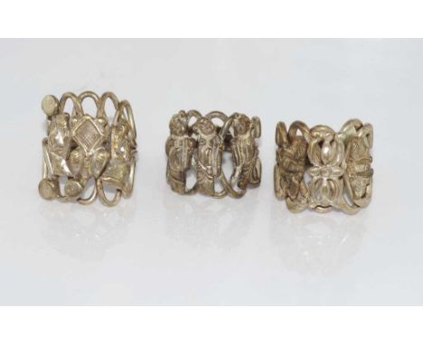 Three vintage Chinese rings with figures on two and insect on the other, sizes: various