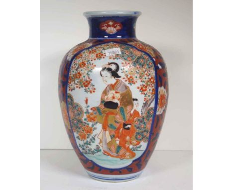 Vintage Japanese imari mantle vase decorated with figures in cartouche, on floral decorated ground. Height 25cm approx.
