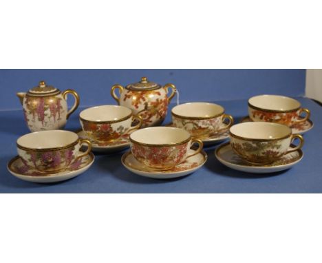 Fourteen piece Satsuma tea set 6 teacups & saucers, creamer and sugar bowl. Mostly bird and foliage decoration, and including