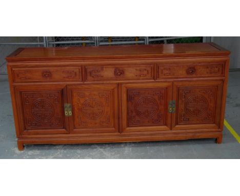 Chinese rosewood sideboard cabinet with ornately carved front comprising of 3 drawers and 4 doors (opening to an inside shelf