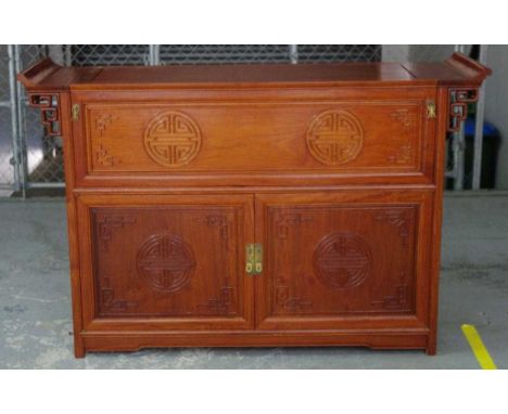 Chinese rosewood cocktail cabinet with lift lid top and fold down shelf opening to a fitted interior above 2 doors with insid