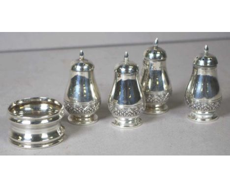 Four American sterling silver pepperettes together with a sterling silver napkin ring hallmarked Birmingham 1920, 132grams ap