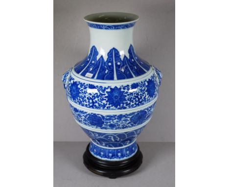 Chinese ceramic blue & white vase blue & white floral decoration, with applied elephant head mask handles. Character mark to 