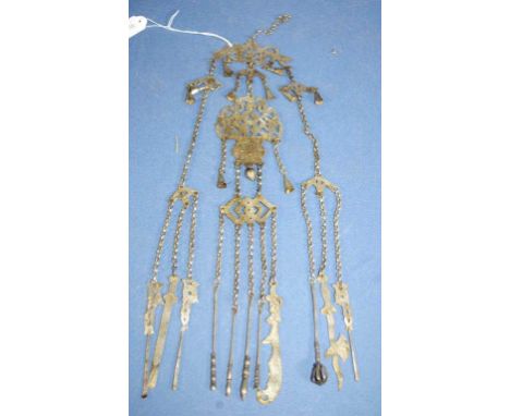 Vintage Chinese silver plated chatelaine with many suspended utensils.