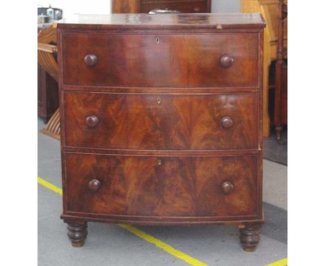 19th century mahogany bow front chest of drawers in campaign style, divided into two parts at the centre with three long draw