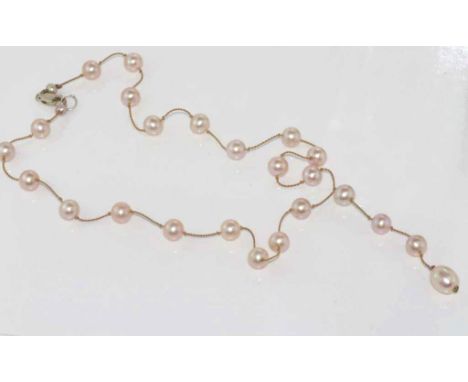 Delicate pink pearl necklace with pearl drop and silver clasp