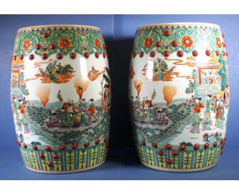 Pair Chinese ceramic stools each decorated with figures on floral background. Barrel shaped .Height 50cm approx (each).