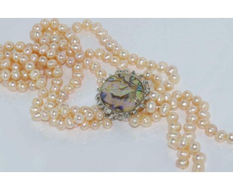 Boxed three strand pearl necklace with paua shell clasp (worn to the front), freshwater pearls, cream colour