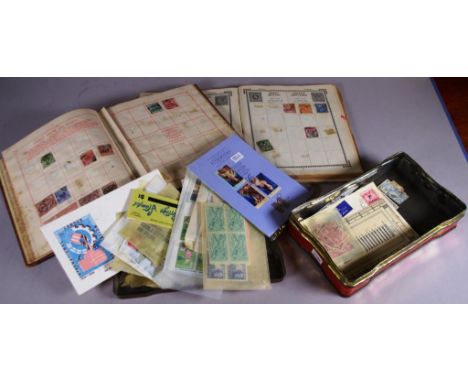 Two various early stamp albums each containing a small quantity of Australian and foreign stamps; together with tin containin