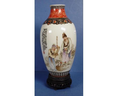 Chinese ceramic handpainted vase decorated with figure of a duck seller, with calligraphy to body of vase and decorated neck.