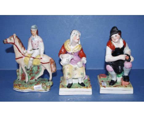 Three antique English ceramic figures comprising a Staffordshire man on horseback & 2 seated figures, 17.5cm high (tallest) a